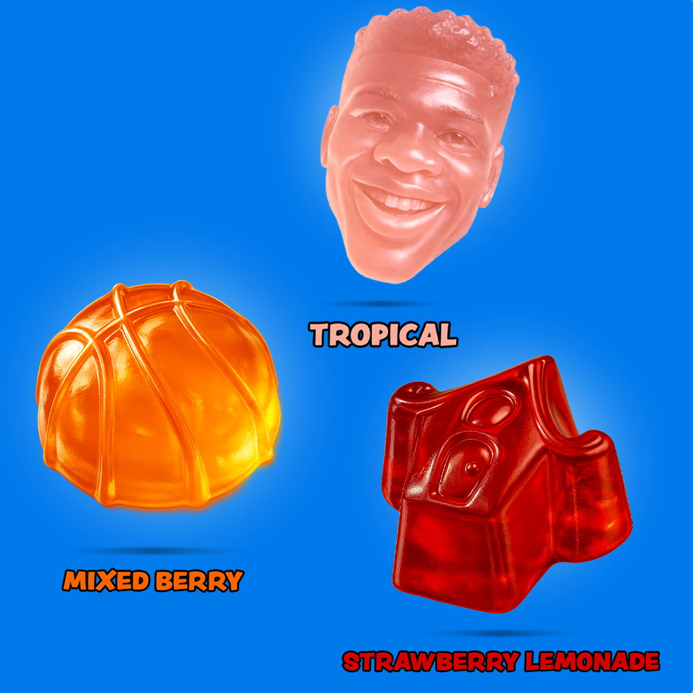 Gummy candy shaped like a basketball, a man's face, and a bottle labeled 'Tropical', 'Mixed Berry', and 'Strawberry Lemonade' on a blue background.